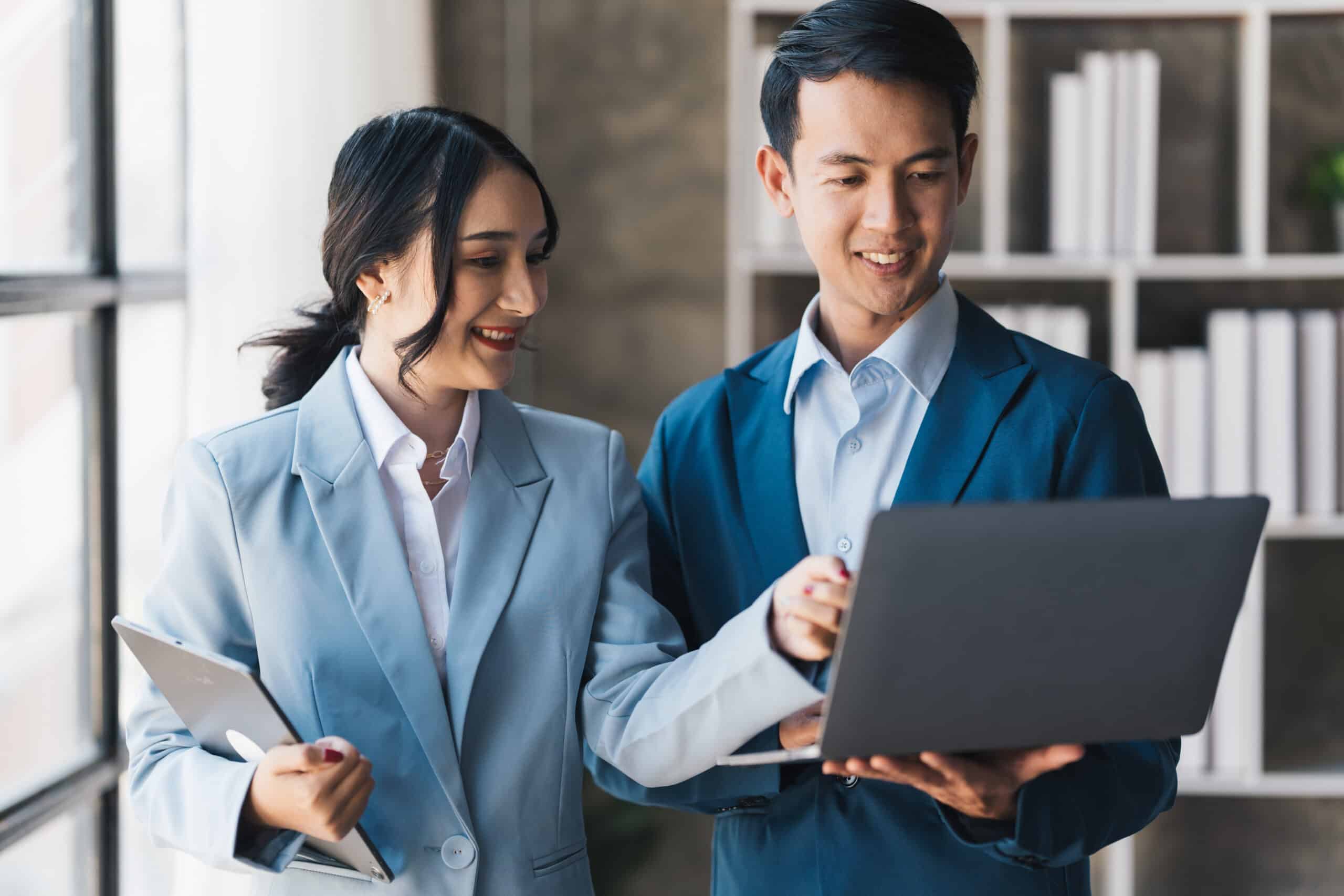 Asian successful bisiness people working todether to get their p